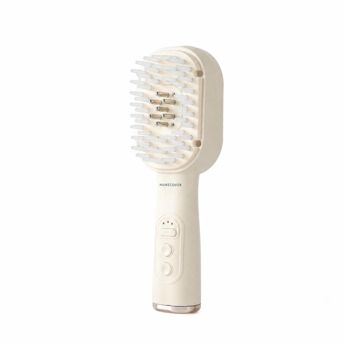 HAIRECOVER cream scalp brush with soft silicone tips and seven metal pins, front three-quarter view on white