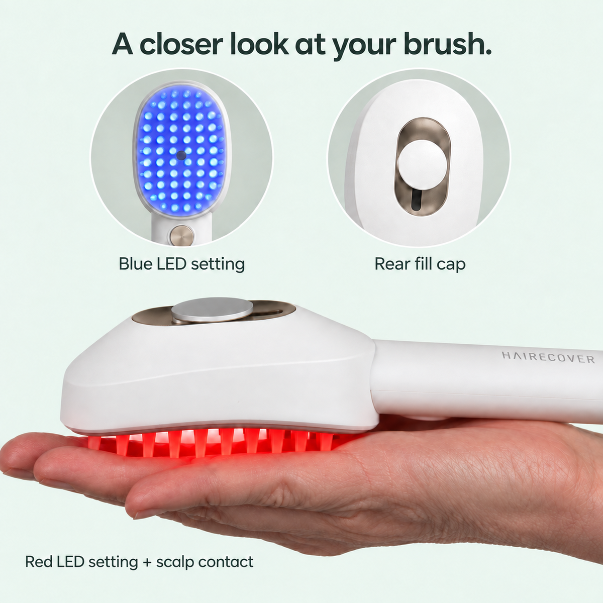 Macro side view of the HAIRECOVER brush resting on a palm, with blue LED front and rear fill-cap details.
